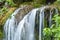 Flowing cascade in forest. Long exposure