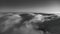Flowing clouds under JeÅ¡tÄ›d. Photographed from a drone - landscape black and white photo