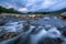 Flowing creek with rocks and stones, landscape and nature