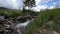 Flowing Creek and small bridge near Sprague Lake