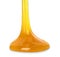 Flowing orange slime on white background. Antistress toy