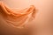 A flowing peach fuzz color fabric on soft minimal background