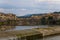 Flowing rive area flooding weir on the River Arno, Florence