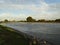 A flowing river with meadows on both sides. the IJssel in the Netherlands