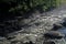 Flowing water over rocks and boulders