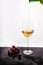 Flowing wine on white background and grape