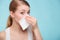 Flu allergy. Sick girl sneezing in tissue. Health