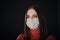 Flu cold or allergy symptom. Sick young woman sneezing in mask isolate on black background. Health care. Studio shot. Business