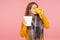 Flu treatment. Portrait of sick ginger girl wearing big scarf, holding napkin and drinking hot tea, treating influenza and high