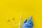 Flu vaccination. Ampoule, syringe, medic`s hand on yellow background top view copy space