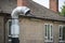 Flue chimney fixed to building exterior wall stainless steel from exhaust boiler plant room