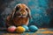 A fluffy brown and white rabbit sitting amidst several colorful Easter eggs against a whimsical blue