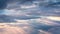 Fluffy cumulus clouds moving fast in time-lapse. Evening sky, cloudy heaven looped motion background. Timelapse