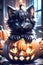 Fluffy Halloween Cute Kitten sitting on a pumpkin