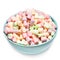 Fluffy multi colourful marshmallows in blue round bowl isolated