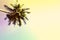 Fluffy palm tree crown on sunny blue sky background. Vintage yellow toned photo.