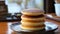 Fluffy Pancake Stack on Plate with Powdered Sugar