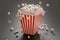 Fluffy popcorn in stripped bucked. 3D rendered illustration