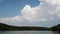 Fluffy storm clouds over lake timelapse, Slovakia
