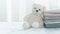 Fluffy white bear doll with soft comfortable pink grey blue fabric cloth stack white cozy home interior web design banner