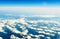 Fluffy white clouds and blue sky from airplane