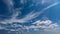 Fluffy white clouds on blue sky at sunny summer day