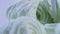 Fluffy white marshmallow in blue round bowl on old wooden table with copy space close up. Close up of many plump sweet