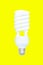 Fluorescent spiral light bulb isolated on yellow background