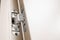 Flush-mounted metal door hinges hidden embedded in wooden canvas