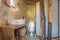 Flush Toilet and Sink in Country Loft Interior Design Room