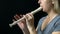 Flute music playing flutist musician performer with bright musical instrument