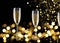 flutes with champagne or fizzy white wine on black background with blurred sparkles in the back