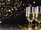 flutes with champagne or fizzy white wine on black background with blurred sparkles in the back