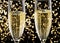 flutes with champagne or fizzy white wine on black background with blurred sparkles in the back