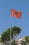 Fluttering Albanian flag blue sky in background