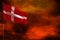 Fluttering Denmark flag mockup with blank space for your text on crimson red sky with smoke pillars background. Troubles concept