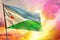 Fluttering Djibouti flag on beautiful colorful sunset or sunrise background. Success concept