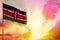 Fluttering Kenya flag in top left corner mockup with the space for your text on beautiful colorful sunset or sunrise background