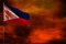 Fluttering Philippines flag mockup with blank space for your text on crimson red sky with smoke pillars background. Troubles