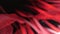 Fluttering red background ribbons. Black background with red color lines. Red nailon stripes. Conceptual romantic