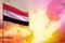 Fluttering Yemen flag in top left corner mockup with the space for your text on beautiful colorful sunset or sunrise background