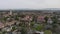 Fly above city, aerial view of complex of buildings. Panoramic view of Stanford University campus. Stanford, California