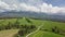 Fly above of fresh green landscape in spring alpine mountains nature