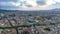 Fly above historic quarter of metropolis. Aerial hyper lapse shot of large city at dusk. Barcelona, Spain