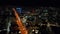 Fly above night city. Illuminated streets and buildings in urban boroughs. San Francisco, California, USA