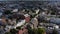 Fly above streets of residential borough. Aerial panoramic view of various houses along streets. London, UK