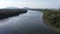 Fly across dark river with mangrove tree