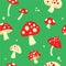 Fly agarics colored seamless pattern.
