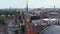 Fly around clock tower. Historic building of St Pancras train station in Camden borough. Aerial panoramic view of city