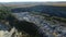 Fly around rubbish dump near weat agricultural fields. Aerial view